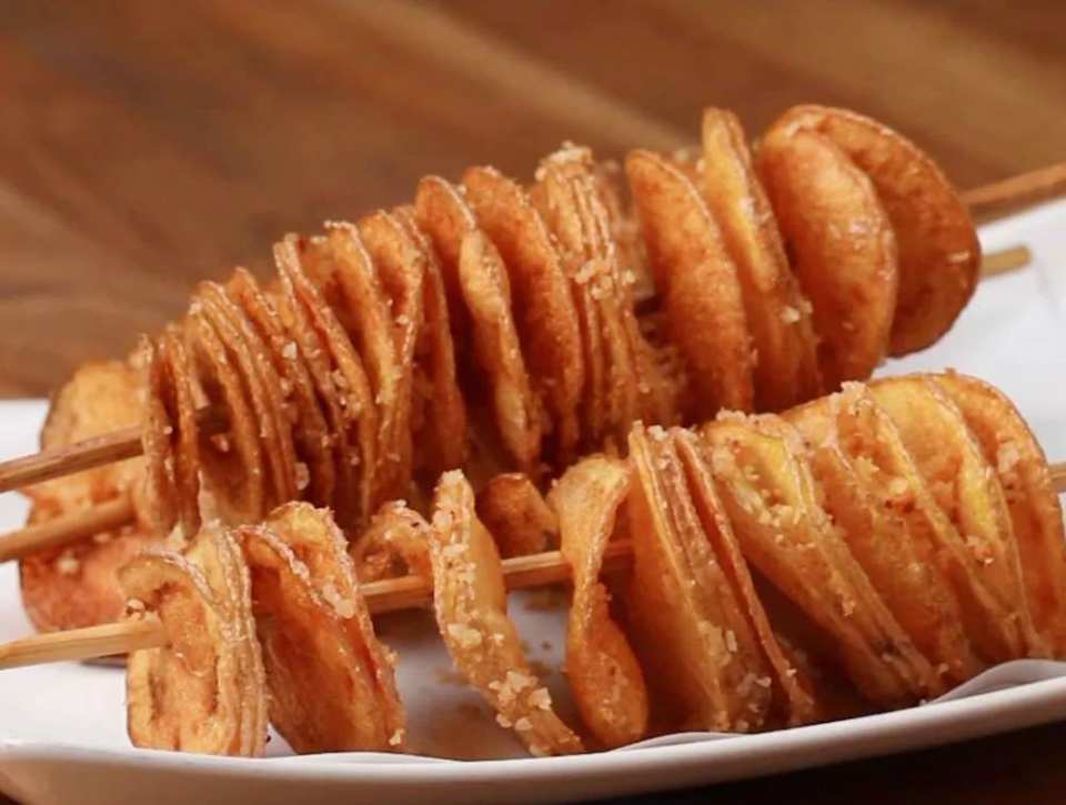 Korean tornado potatoes with a seasoned Parmesan coating